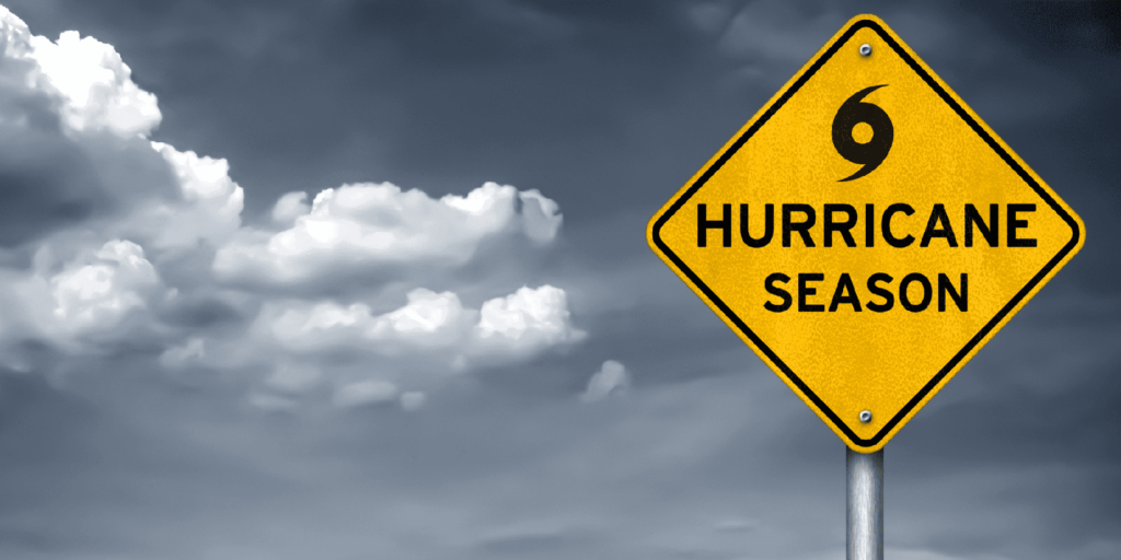 An image featuring a yellow, diamond-shaped warning sign on the right side that reads "HURRICANE SEASON" in bold black capital letters - https://www.rhinspartners.com/